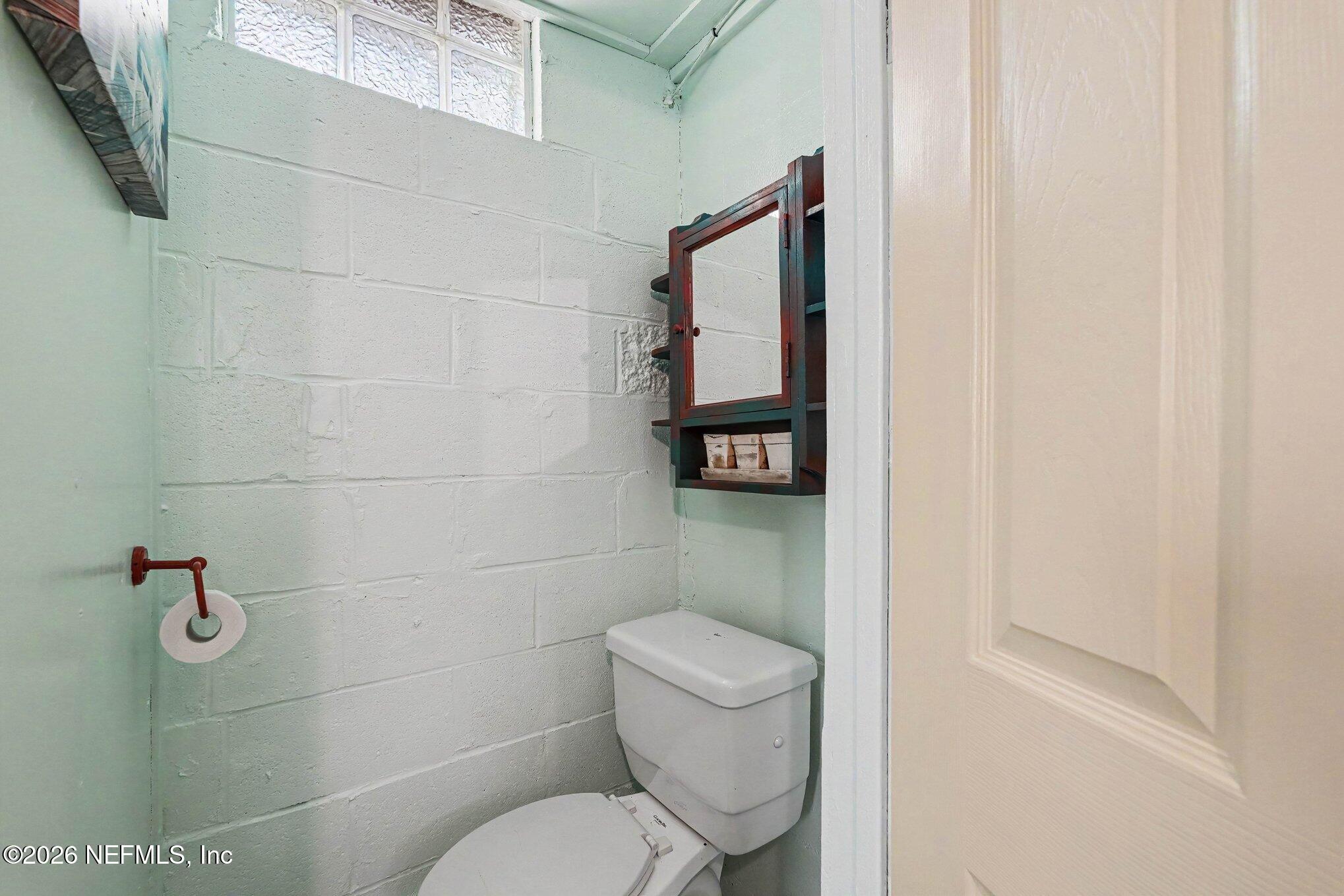 3500 Roosevelt Road Mims, FL 32754 - Photo 21 of 30 a white toilet sitting next to a shower