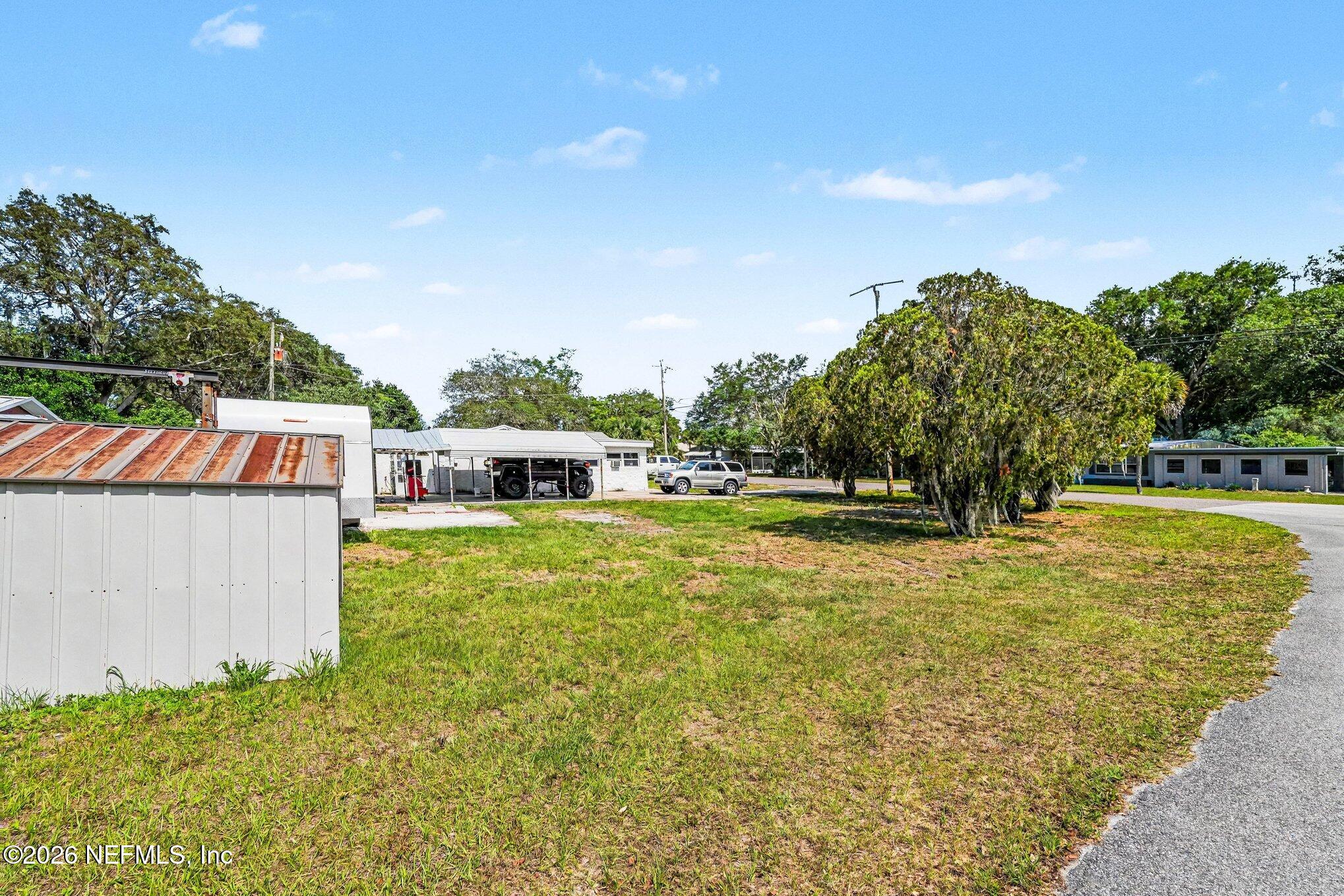 3500 Roosevelt Road Mims, FL 32754 - Photo 28 of 30 a view of a swimming pool with a garden