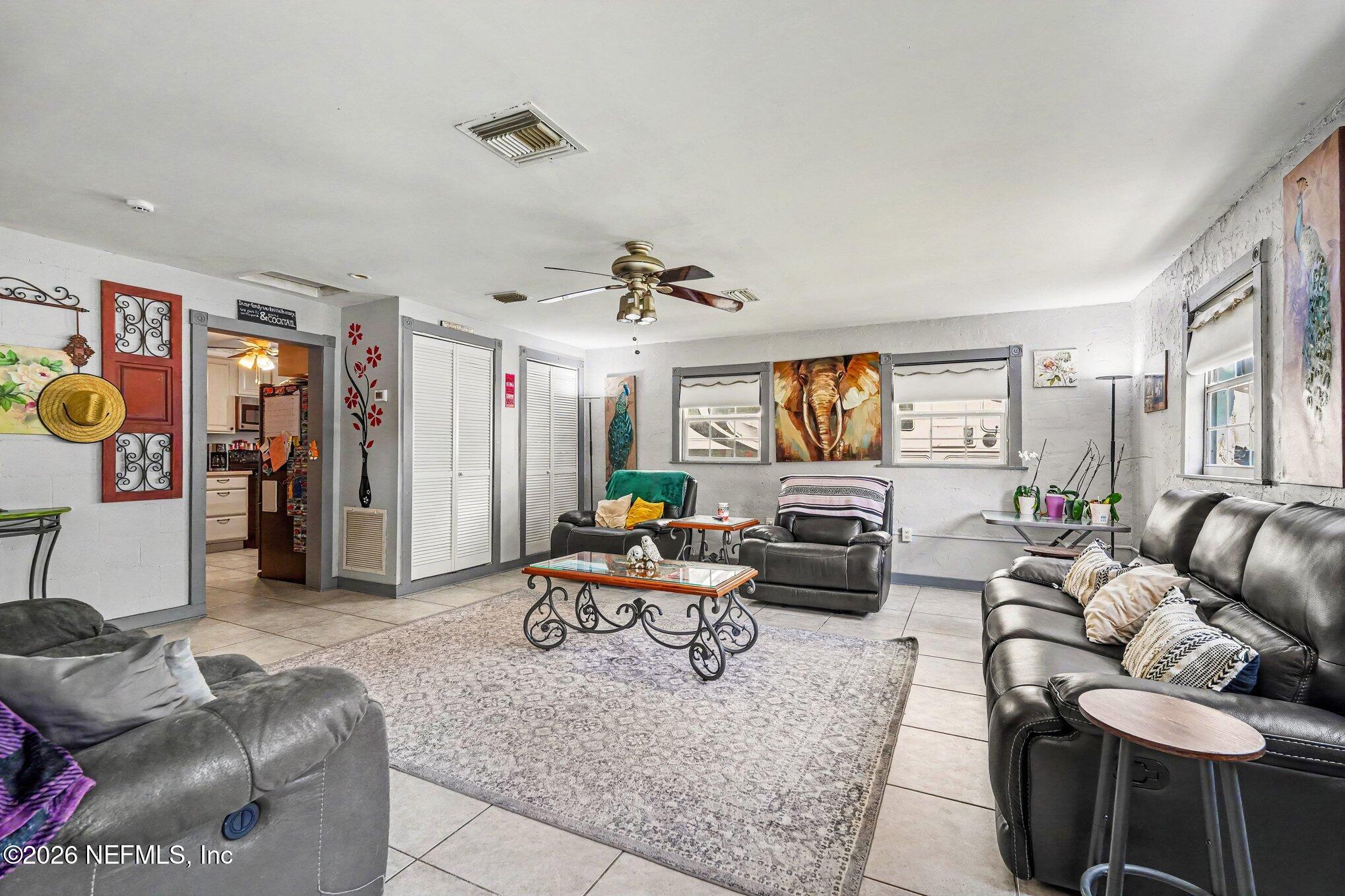 3500 Roosevelt Road Mims, FL 32754 - Photo 5 of 30 a living room with furniture and wooden floor