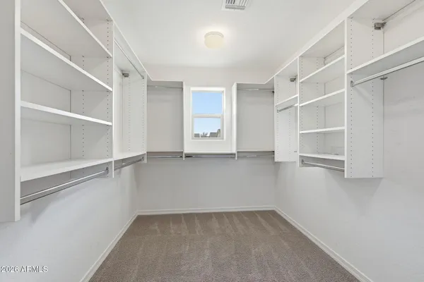 a view of an empty walk in closet