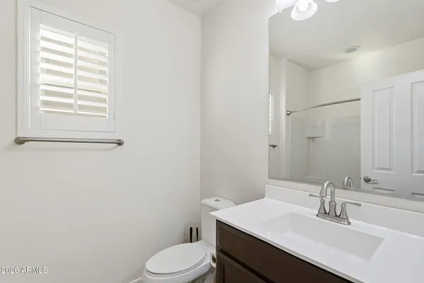 a bathroom with a sink toilet and vanity