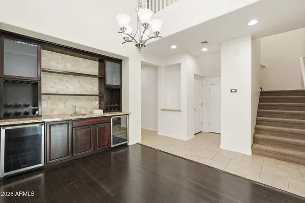 a kitchen with stainless steel appliances granite countertop a stove and a refrigerator