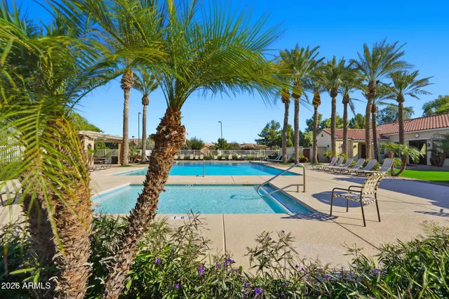 a view of a swimming pool with a patio