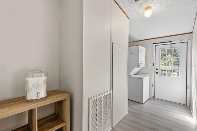 a view of kitchen with furniture and wooden floor