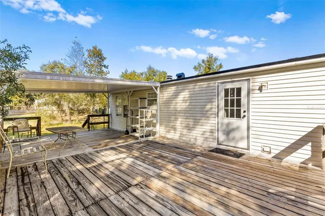 a view of a patio with wooden floor