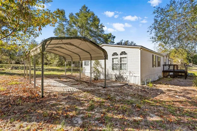 a view of a house with backyard