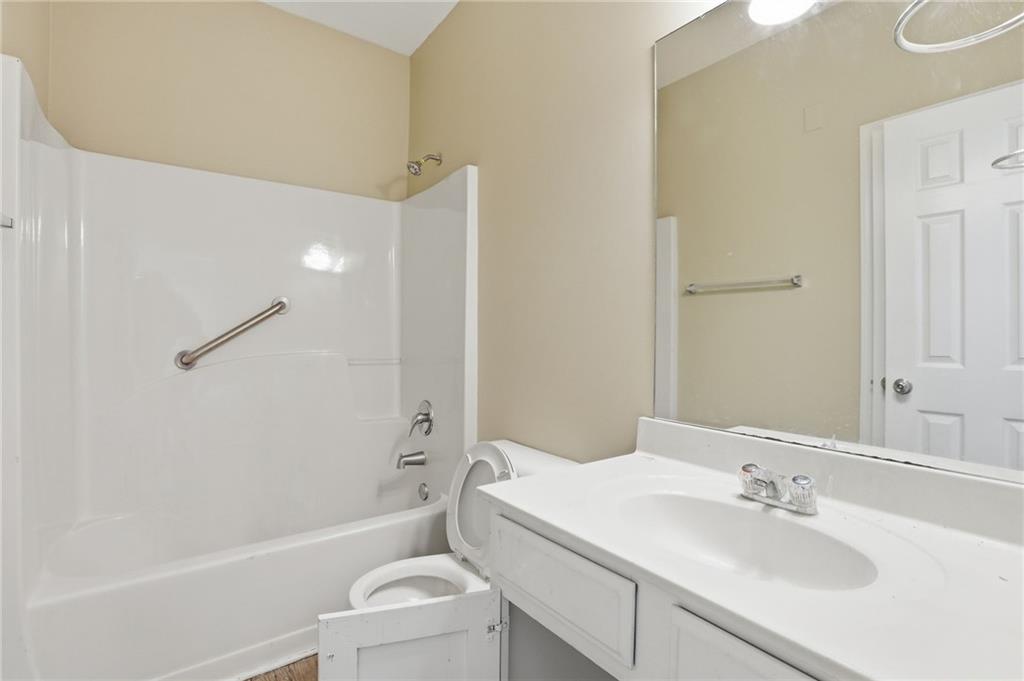 4968 Locherby Drive Fairburn, GA 30213 - Photo 31 of 39 a bathroom with a sink toilet and shower