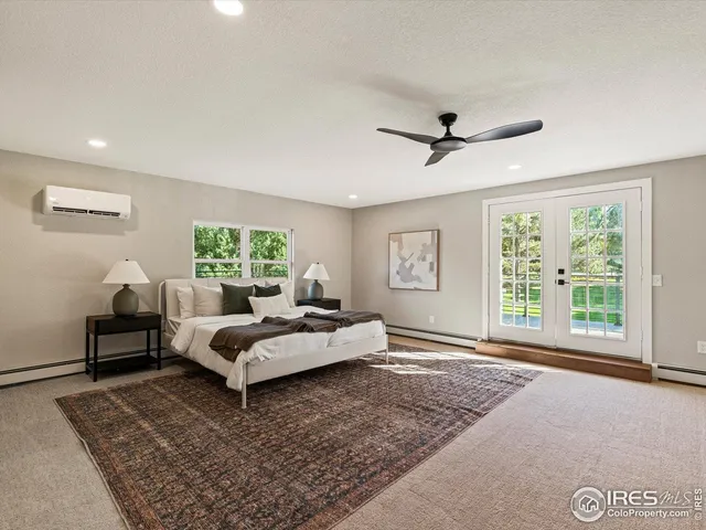 a bed room with a bed and a window