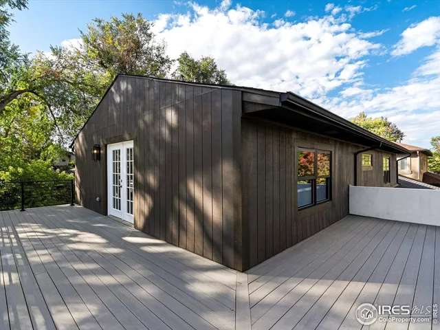 a backyard of a house with wooden fence