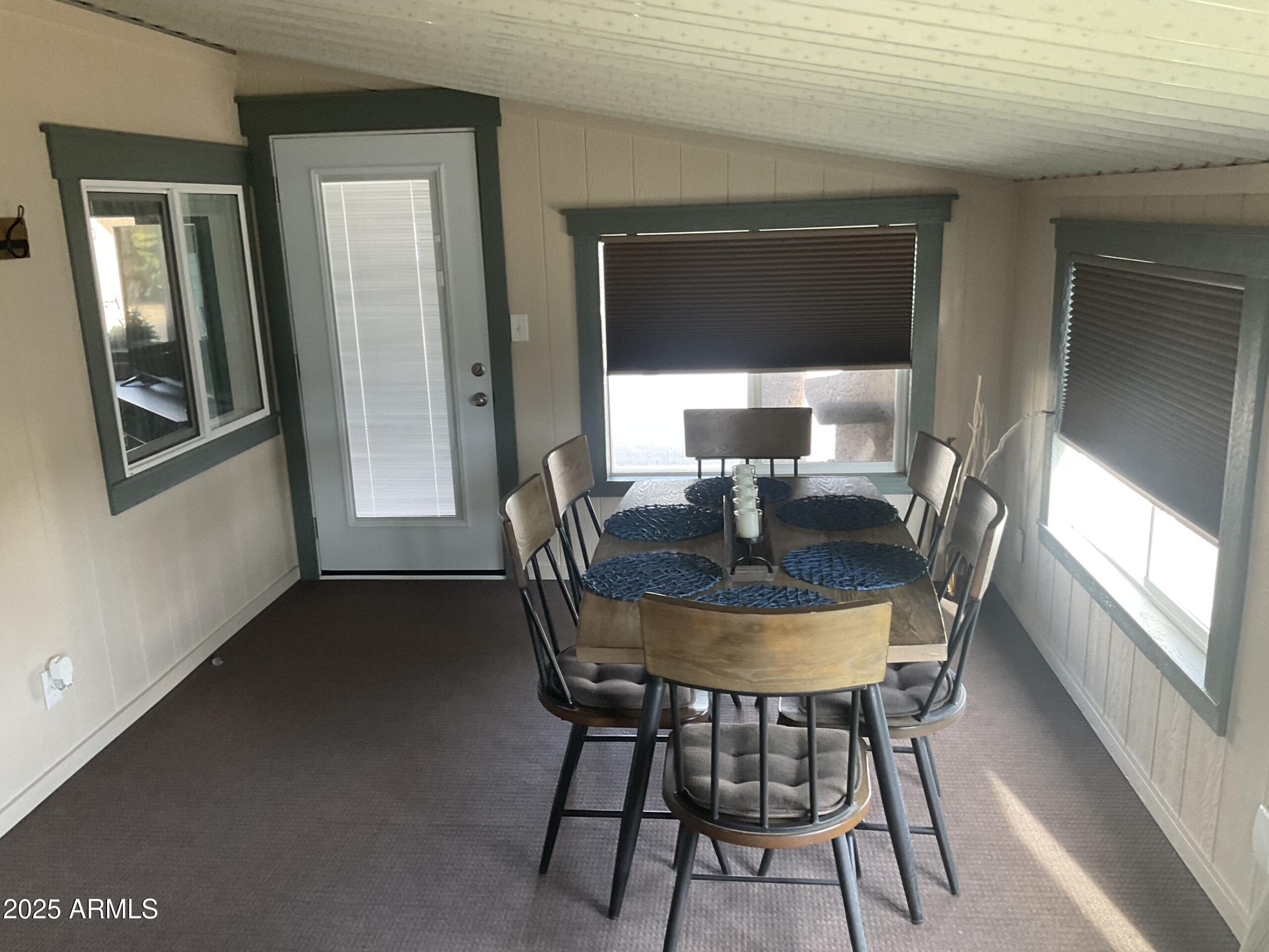 2175 West Southern Avenue, Unit 203 Apache Junction, AZ 85120 - Photo 14 of 28 a dining room with furniture and window