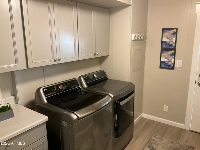a kitchen with a stove and white cabinets