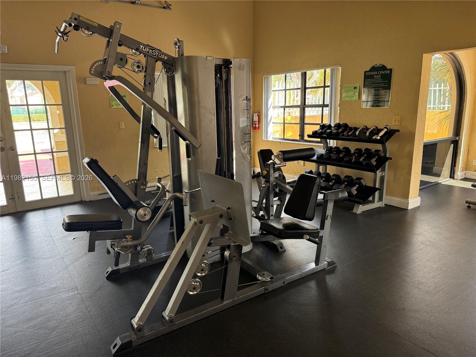 15610 Southwest 80th Street, Unit J105 Miami, FL 33193 - Photo 23 of 38 a view of a room with gym equipment