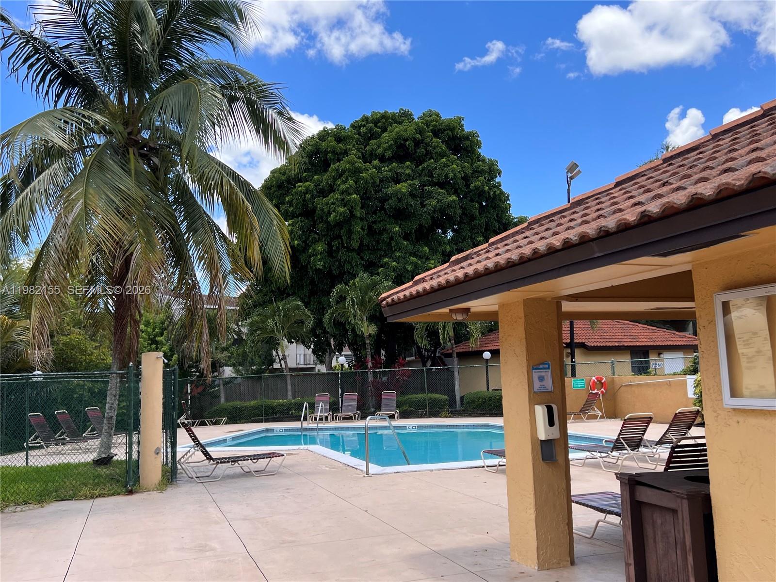 15610 Southwest 80th Street, Unit J105 Miami, FL 33193 - Photo 28 of 38 a view of outdoor space and patio