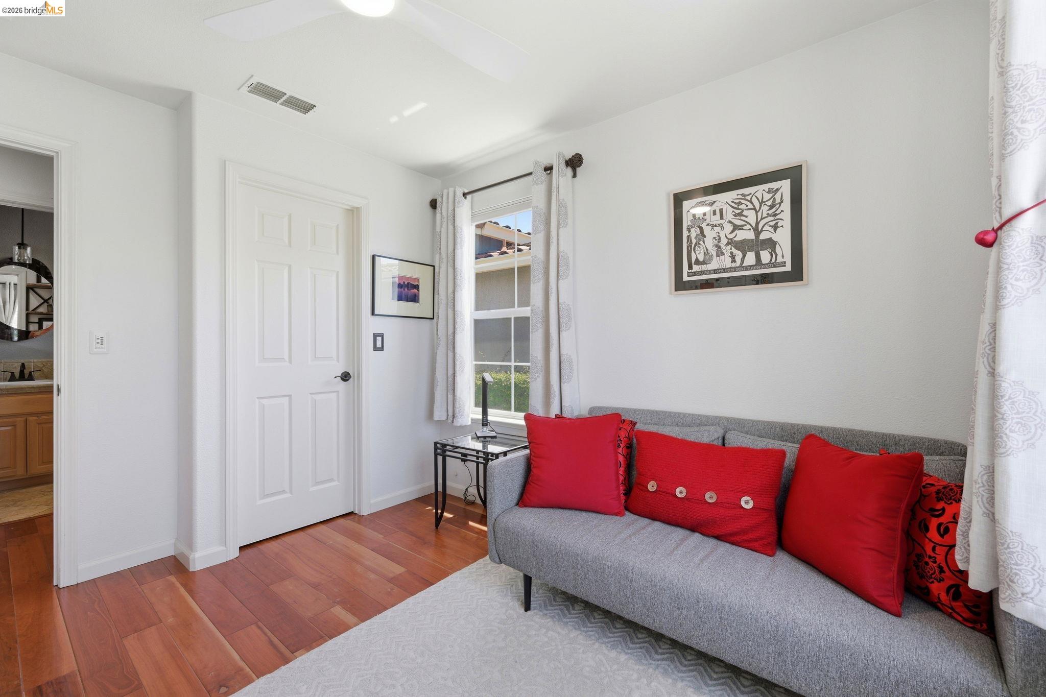 1024 Diamante Rio Vista, CA 94571 - Photo 14 of 27 Bright room featuring light wood-finish flooring, white walls, and a ceiling fan