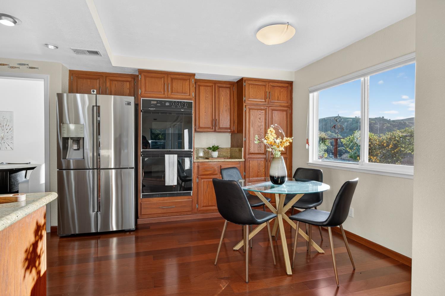 248 Carson Street Hercules, CA 94547 - Photo 18 of 70 a dining room with furniture a chandelier and wooden floor
