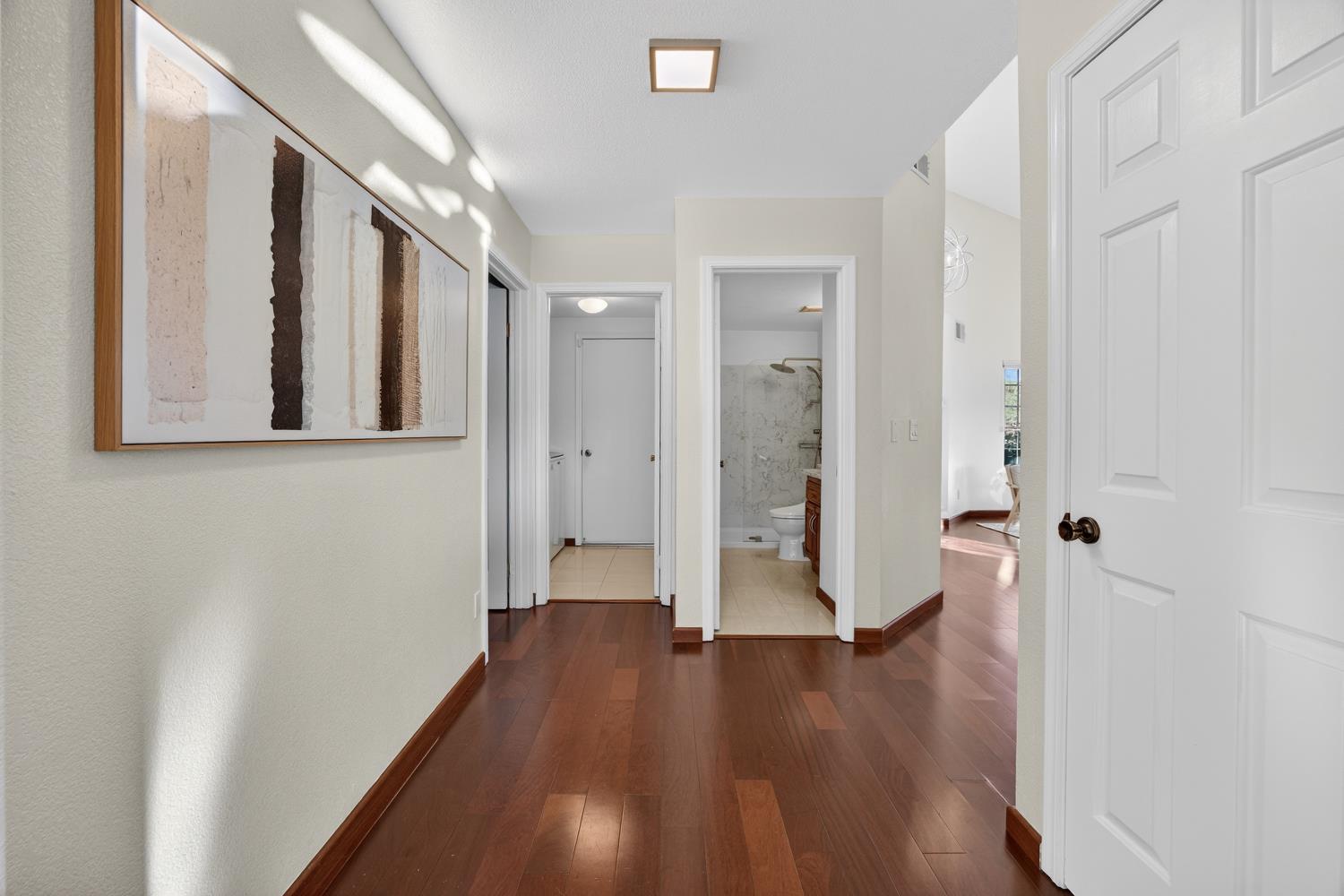 248 Carson Street Hercules, CA 94547 - Photo 22 of 70 a view of an empty room with wooden floor and a bathroom