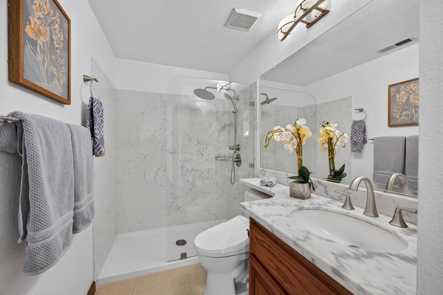248 Carson Street Hercules, CA 94547 - Photo 23 of 70 a bathroom with a granite countertop sink toilet and shower