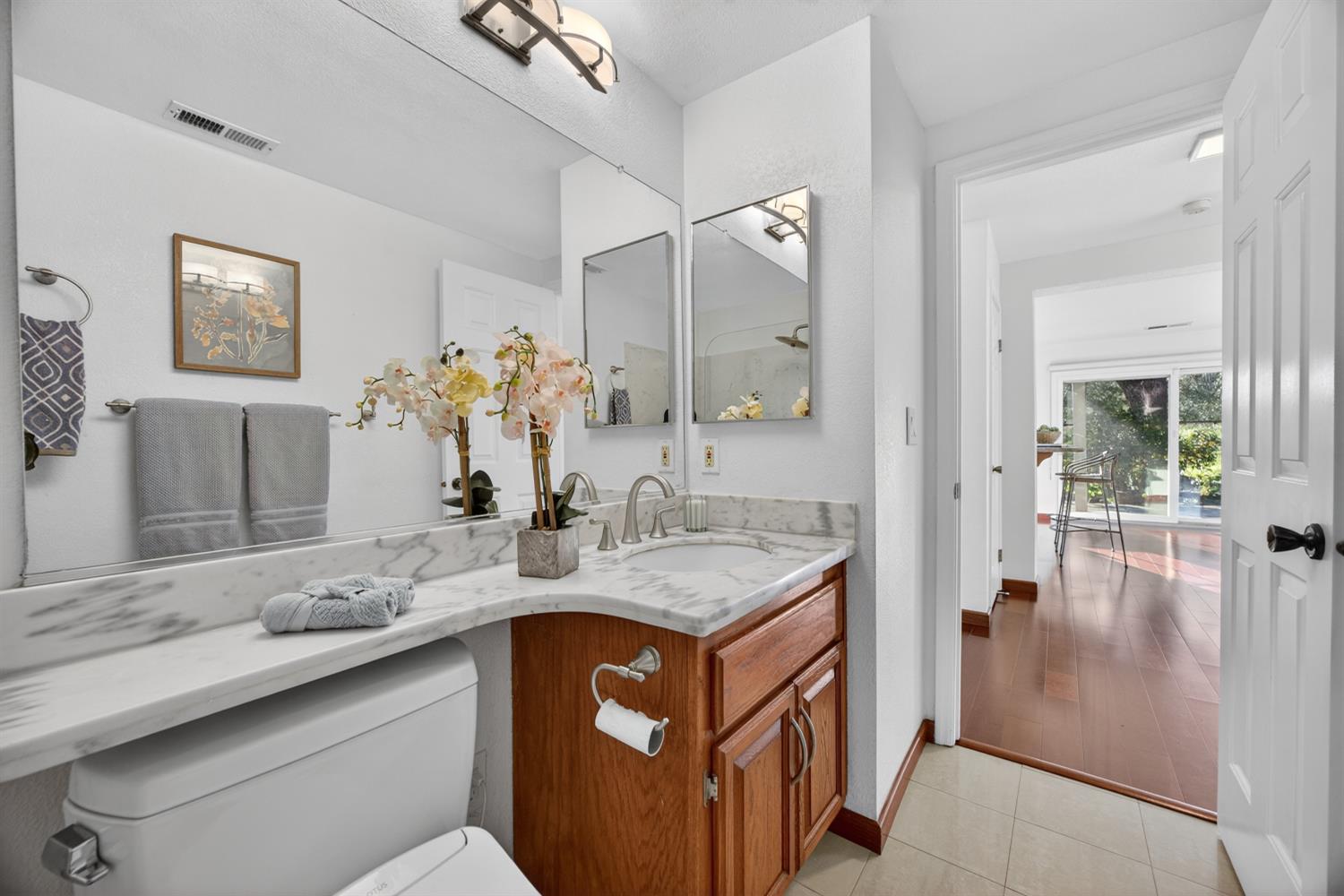 248 Carson Street Hercules, CA 94547 - Photo 25 of 70 a bathroom with a granite countertop sink a mirror and a shower