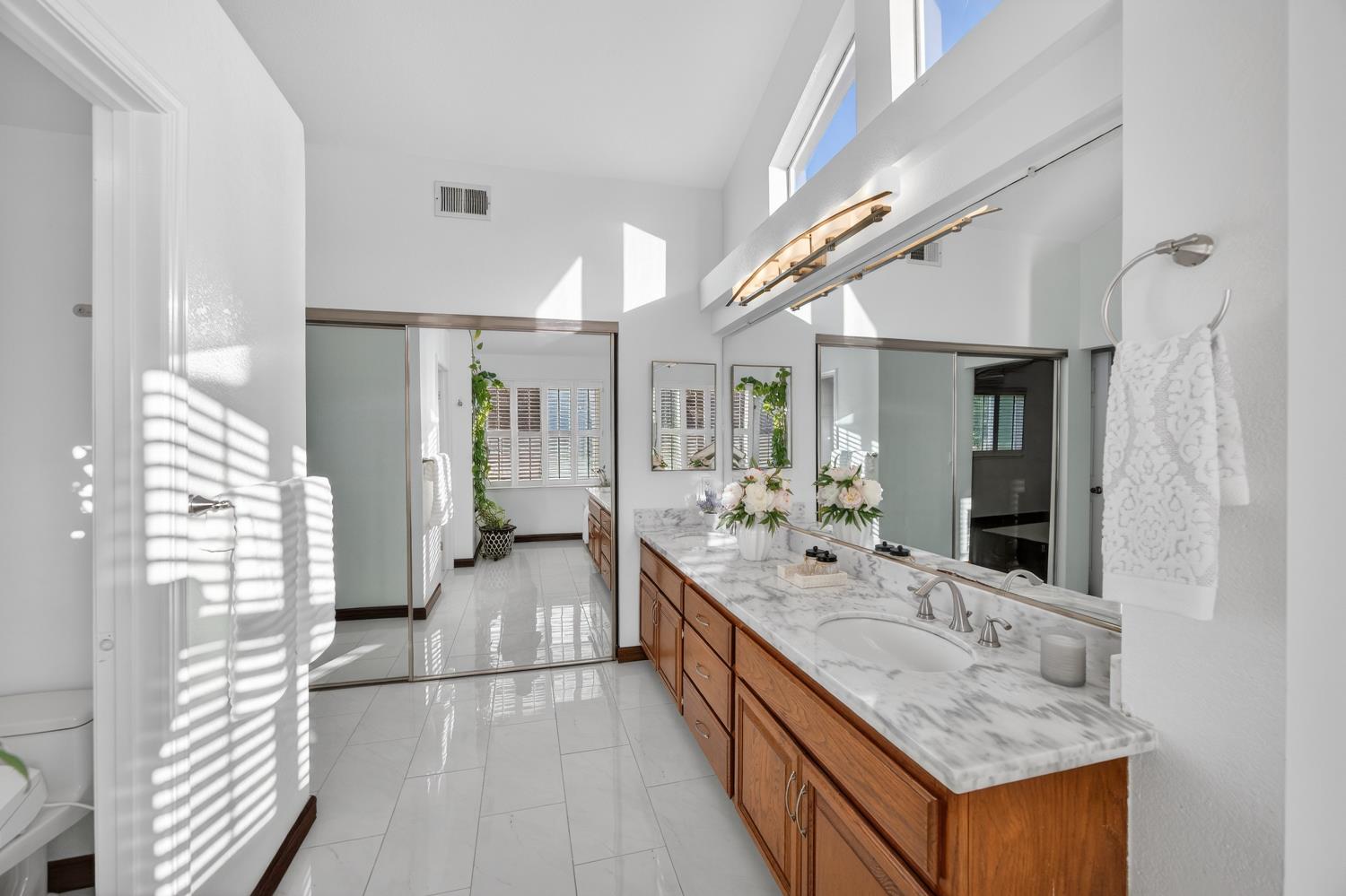 248 Carson Street Hercules, CA 94547 - Photo 37 of 70 a large white kitchen with a large window and stainless steel appliances