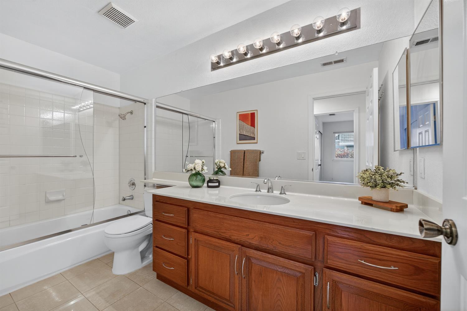 248 Carson Street Hercules, CA 94547 - Photo 42 of 70 a spacious bathroom with a granite countertop sink mirror and toilet