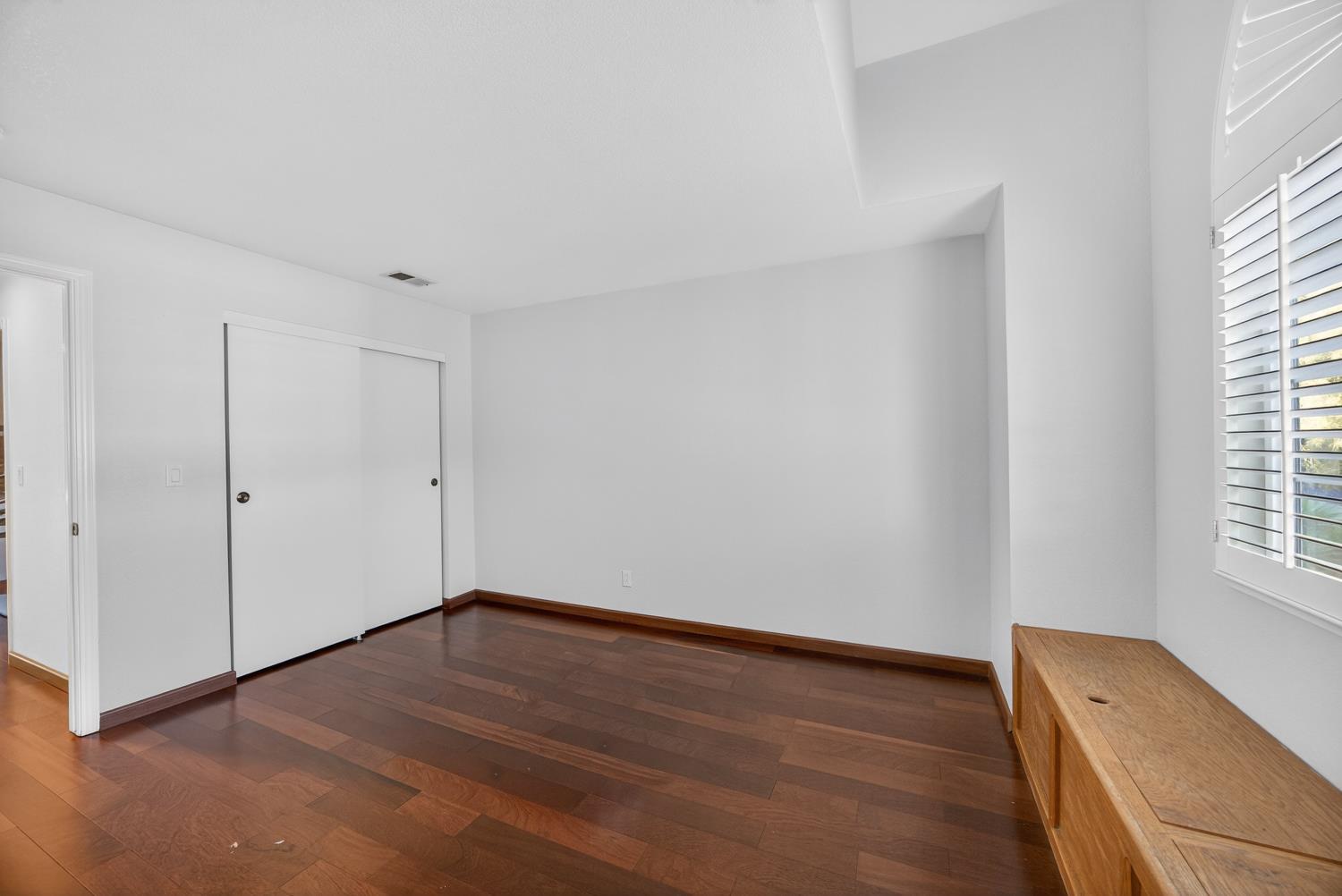 248 Carson Street Hercules, CA 94547 - Photo 45 of 70 a view of an empty room with wooden floor and a window