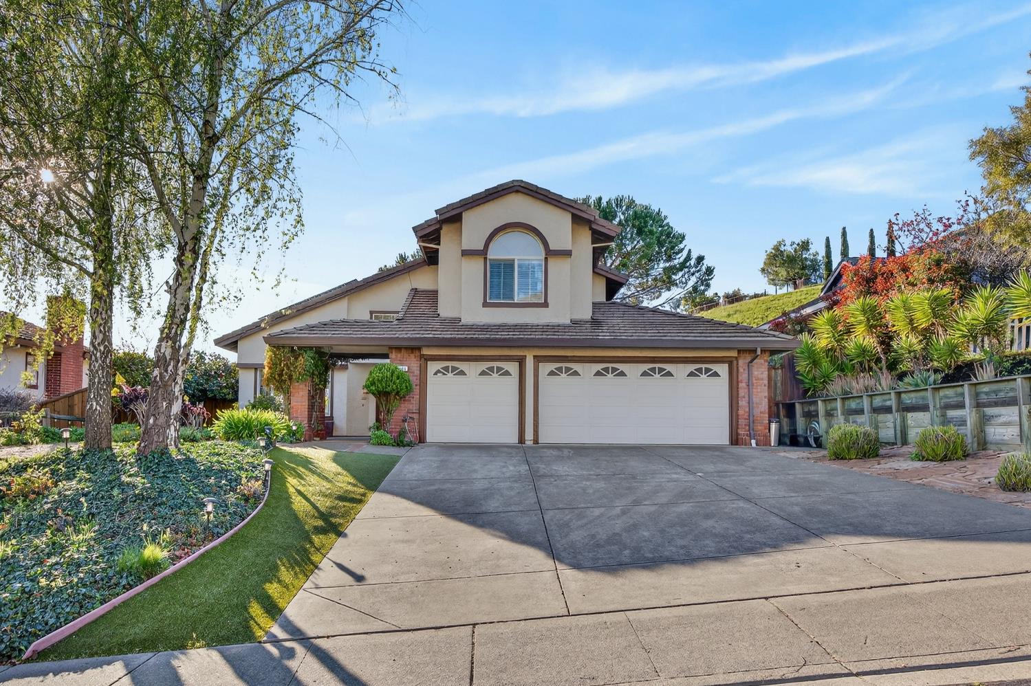 248 Carson Street Hercules, CA 94547 - Photo 5 of 70 a front view of a house with a yard and garage