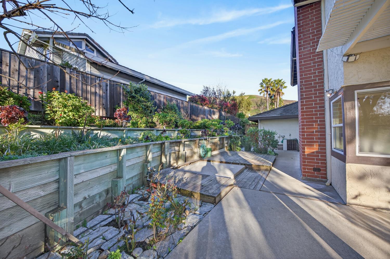 248 Carson Street Hercules, CA 94547 - Photo 51 of 70 a view of a house with a yard and potted plants