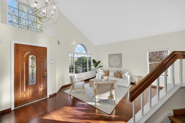 a view of a dining room with furniture window and wooden floor