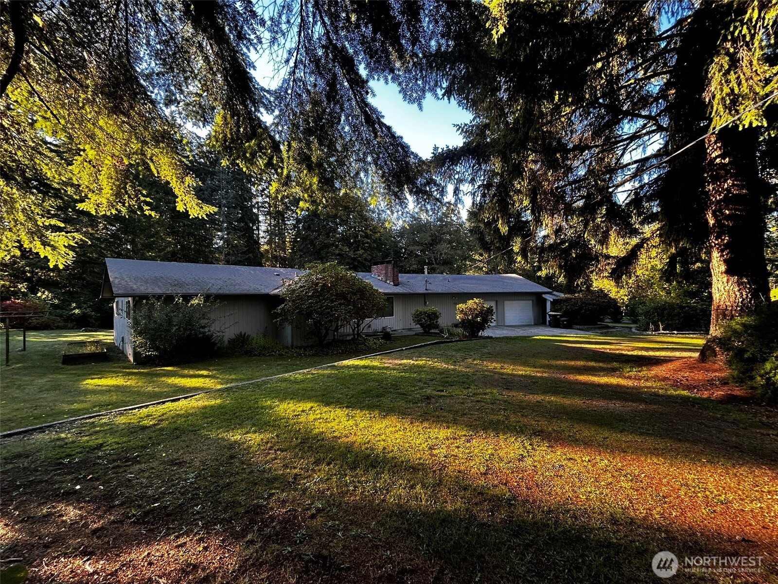 4131 Delphi Road Southwest Olympia, WA 98512 - Photo 1 of 39 a view of a house with swimming pool yard and trees