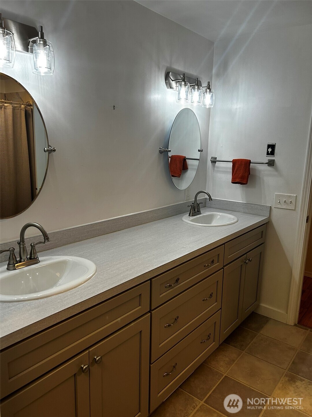4131 Delphi Road Southwest Olympia, WA 98512 - Photo 12 of 39 a bathroom with a double vanity sink and a mirror