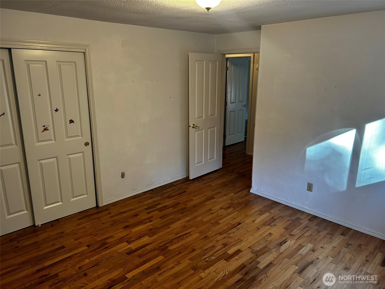 4131 Delphi Road Southwest Olympia, WA 98512 - Photo 14 of 39 a view of an empty room with wooden floor
