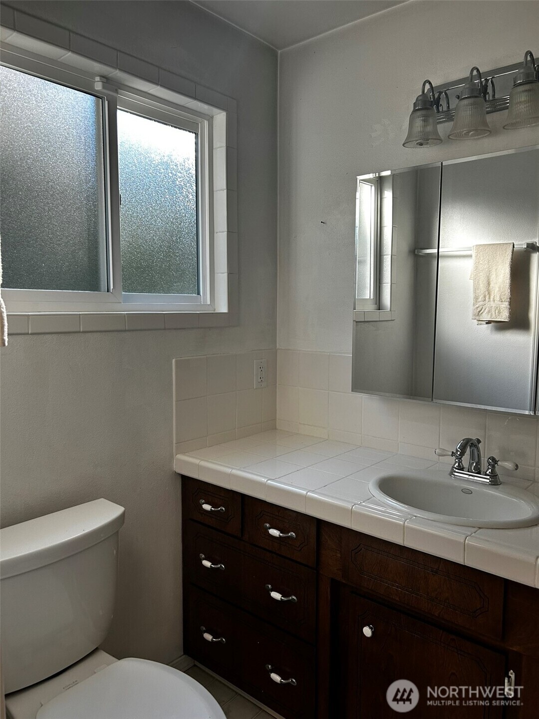 4131 Delphi Road Southwest Olympia, WA 98512 - Photo 16 of 39 a bathroom with a toilet sink and mirror