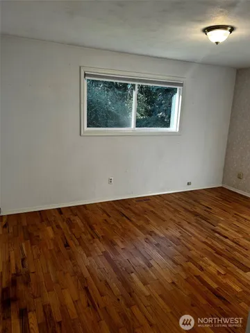 a view of a livingroom with kitchen