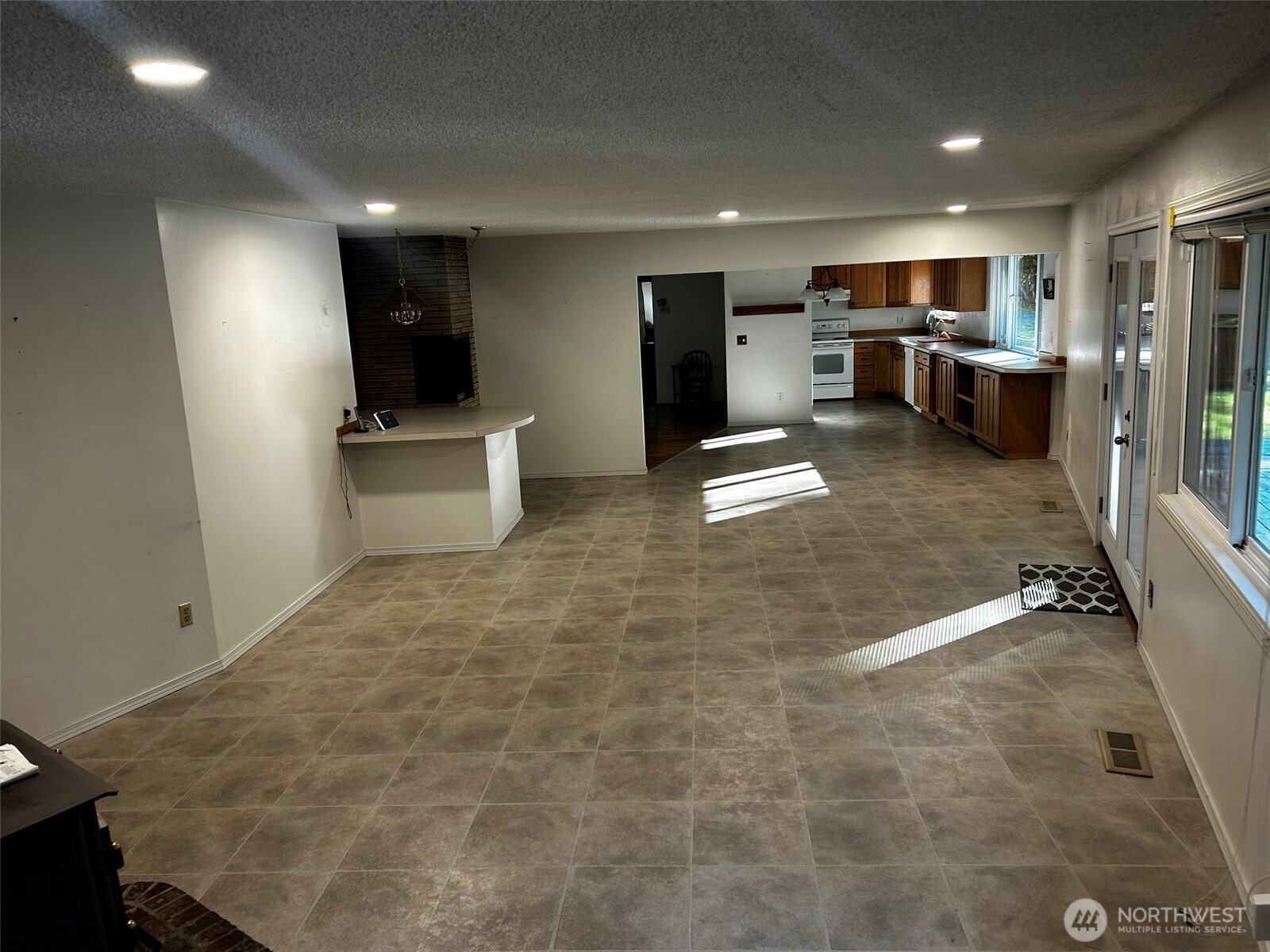 4131 Delphi Road Southwest Olympia, WA 98512 - Photo 24 of 39 a view of a livingroom with kitchen and furniture