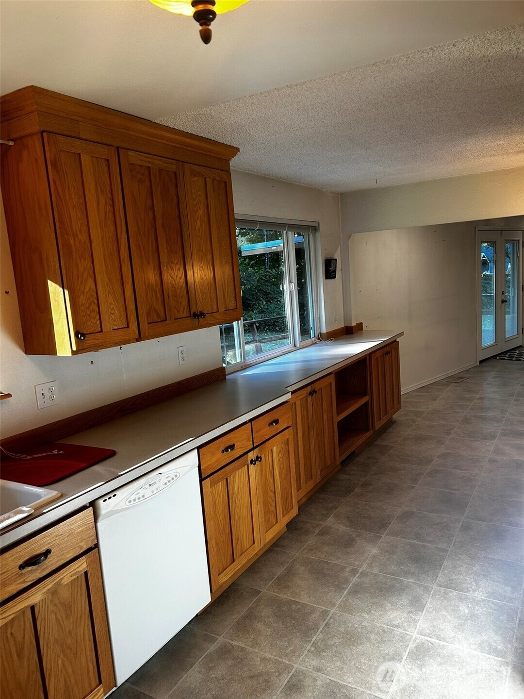 4131 Delphi Road Southwest Olympia, WA 98512 - Photo 3 of 39 a kitchen with stainless steel appliances granite countertop a sink stove and cabinets