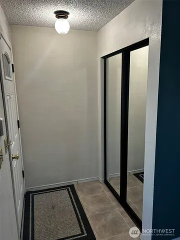 a view of an empty room with a window