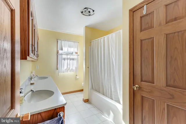 a kitchen with a refrigerator and cabinets