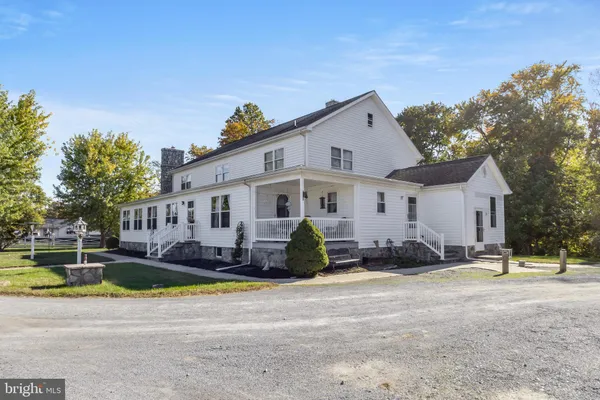 a view of a chair and table in the balcony