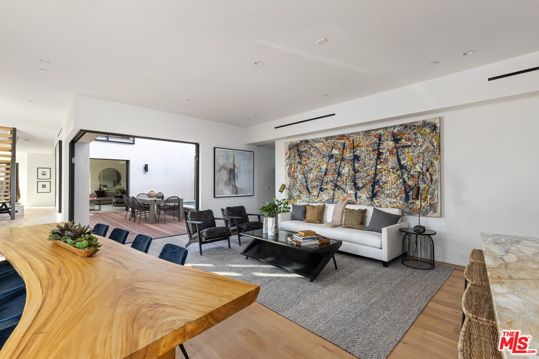 700 Brooks Avenue Venice, CA 90291 - Photo 24 of 53 a living room with furniture large window and a table