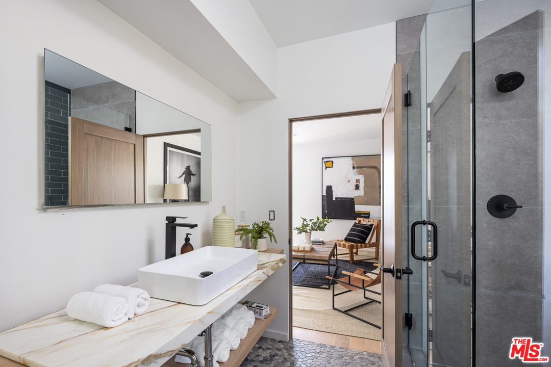 700 Brooks Avenue Venice, CA 90291 - Photo 38 of 53 a bathroom with a sink vanity and mirror