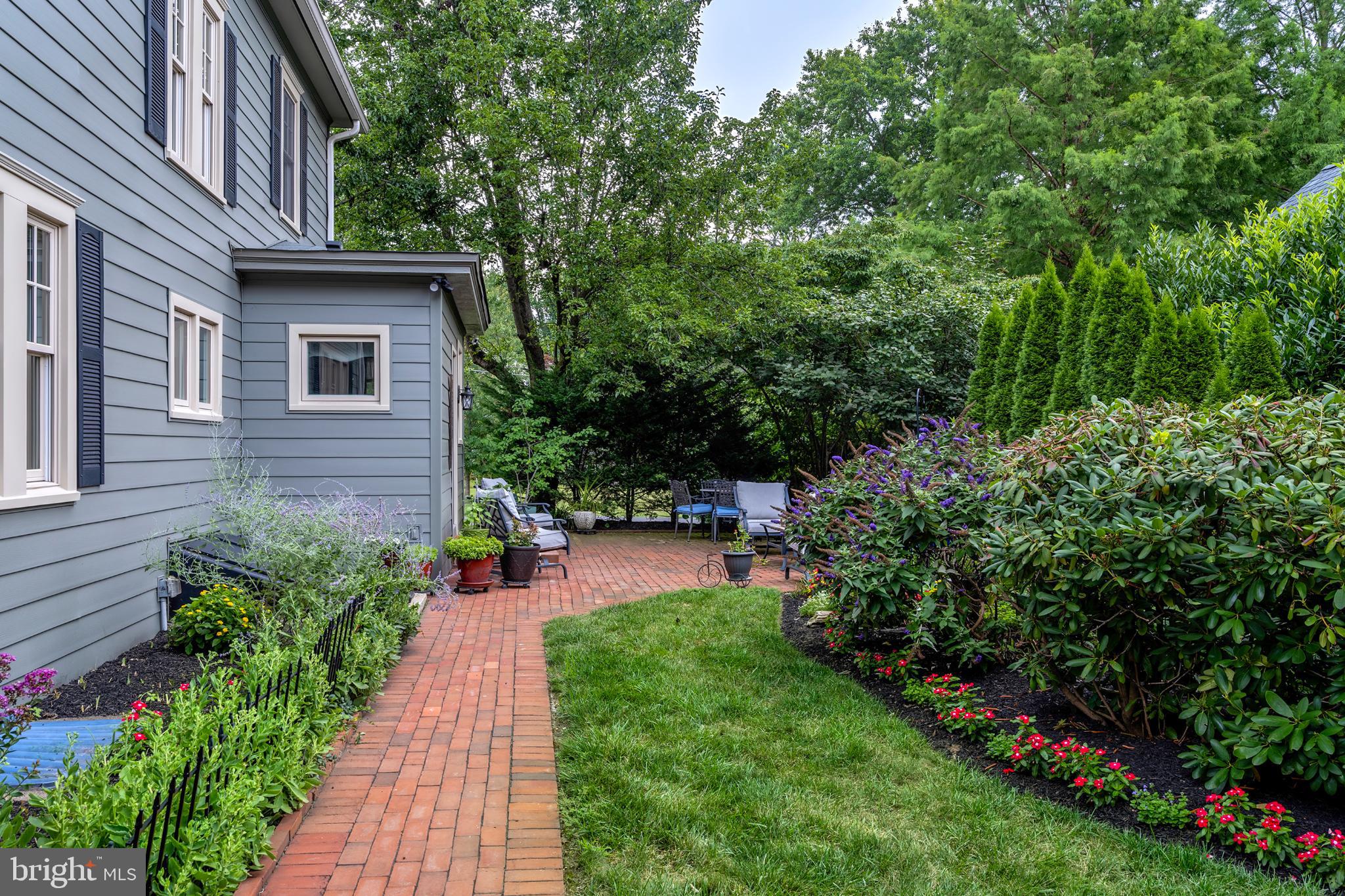 16 Effingham Road Yardley, PA 19067 - Photo 28 of 33 Charming garden path with lush greenery.