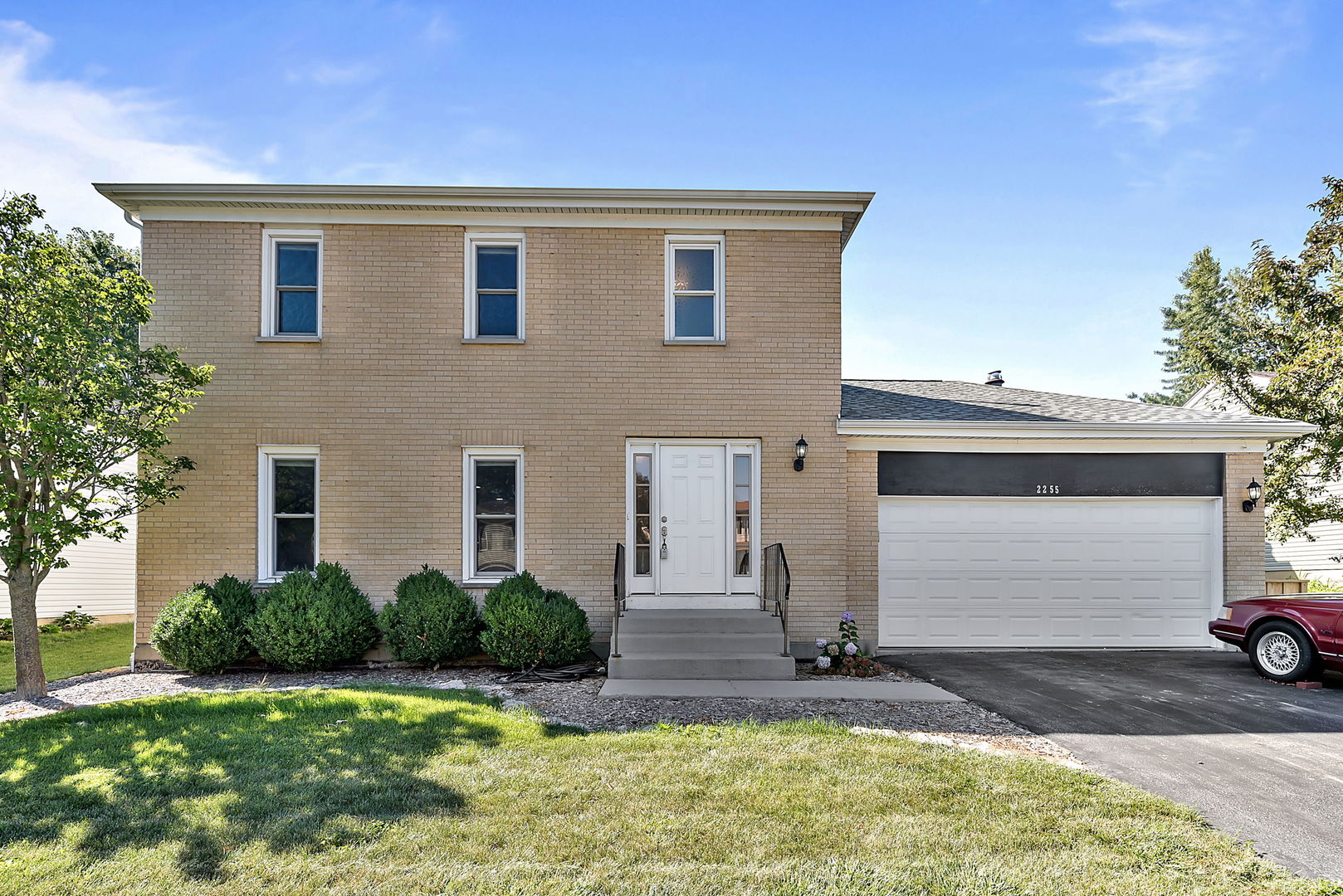 2255 Ridge Avenue Aurora, IL 60504 - Photo 1 of 28 a front view of a house with garden