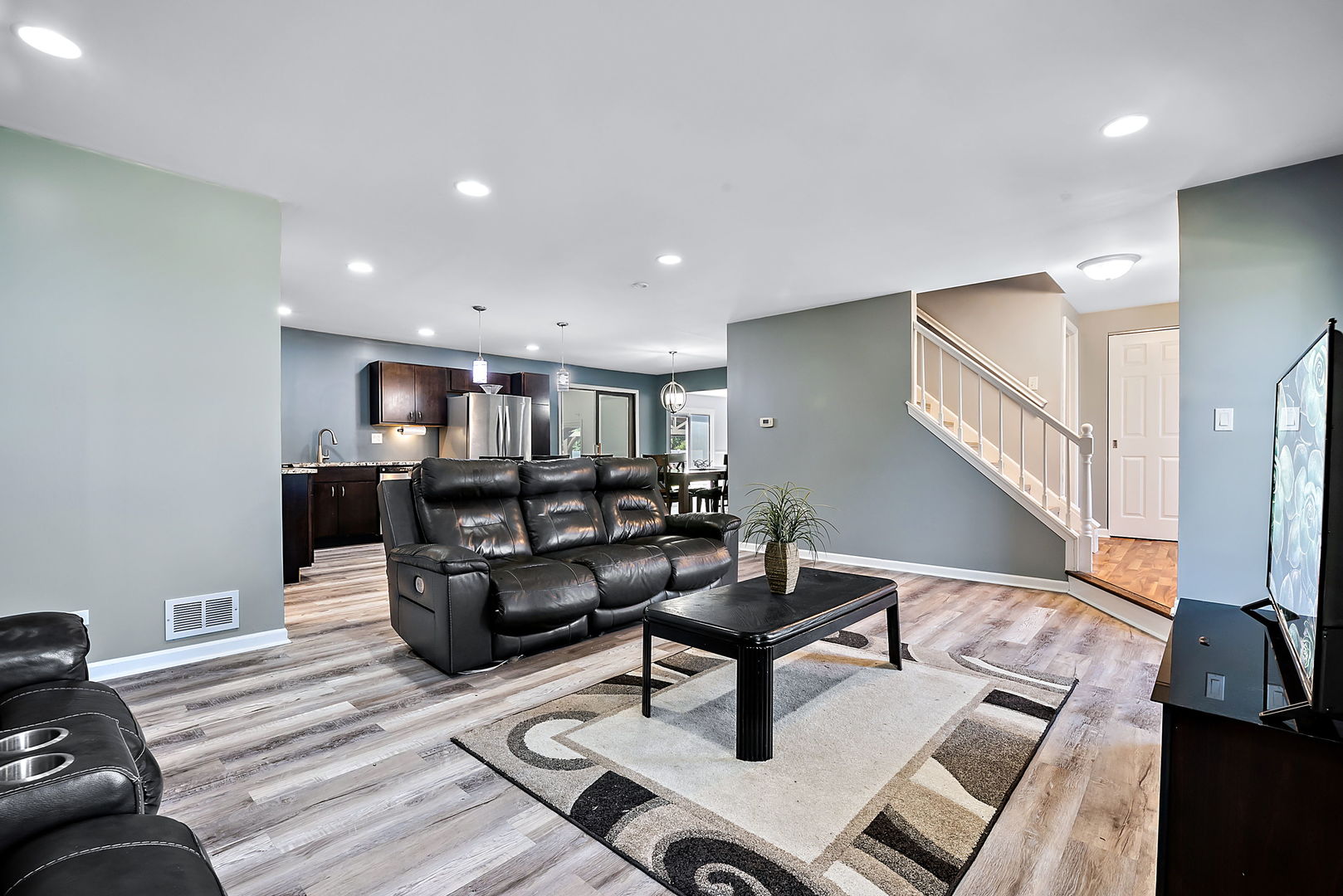 2255 Ridge Avenue Aurora, IL 60504 - Photo 6 of 28 a living room with furniture and a flat screen tv