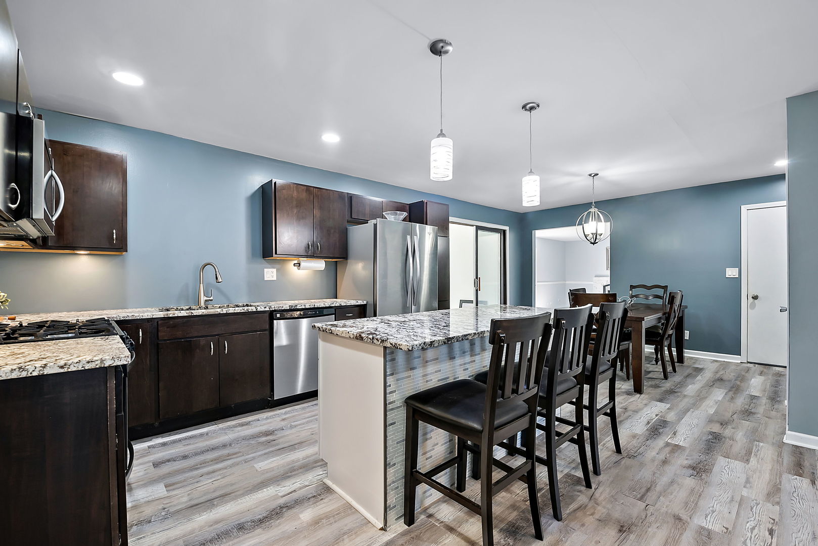 2255 Ridge Avenue Aurora, IL 60504 - Photo 8 of 28 a kitchen with lots of wooden furniture appliances and furniture