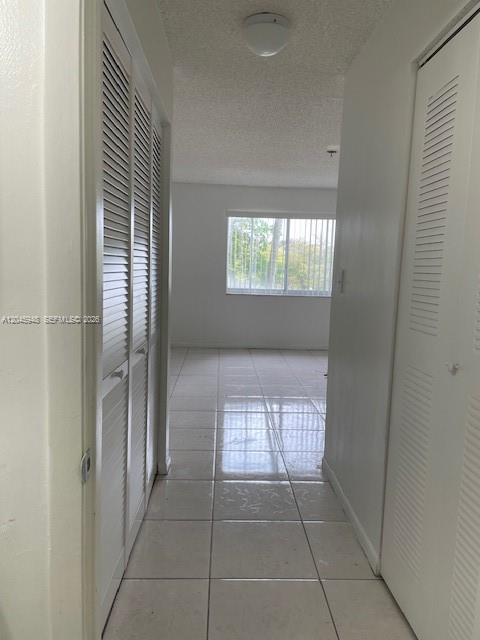 5612 Rock Island Road, Unit 167 Tamarac, FL 33319 - Photo 10 of 16 an empty room with windows