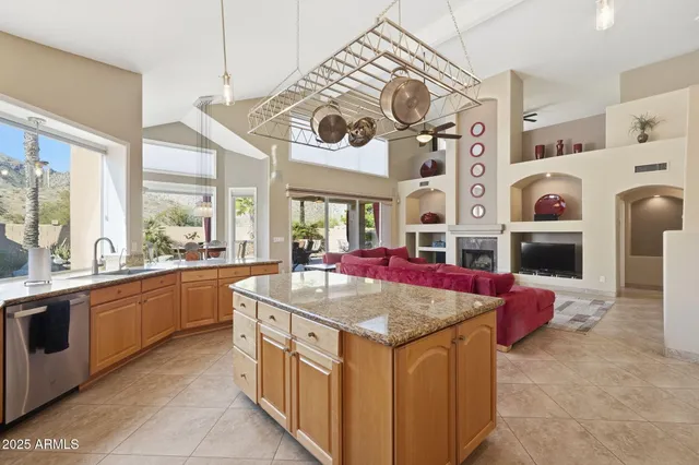 a view of living room with granite countertop furniture and fireplace