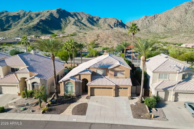 a view of multiple houses with a road