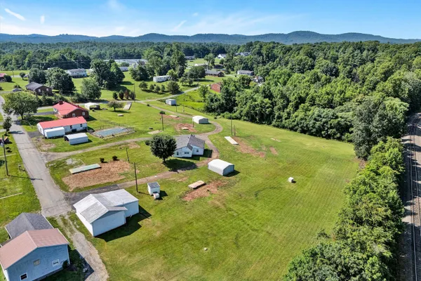 an aerial view of a residential apartment building with swimming pool