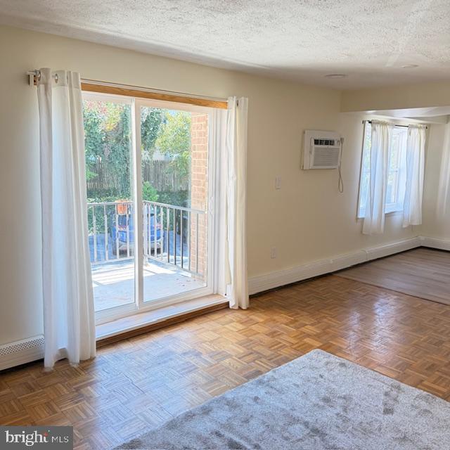 222 East Montgomery Avenue, Unit 207 Ardmore, PA 19003 - Photo 3 of 14 an empty room with wooden floor and windows