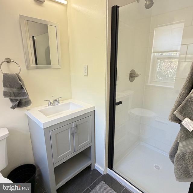 222 East Montgomery Avenue, Unit 207 Ardmore, PA 19003 - Photo 9 of 14 a bathroom with a sink a toilet and shower